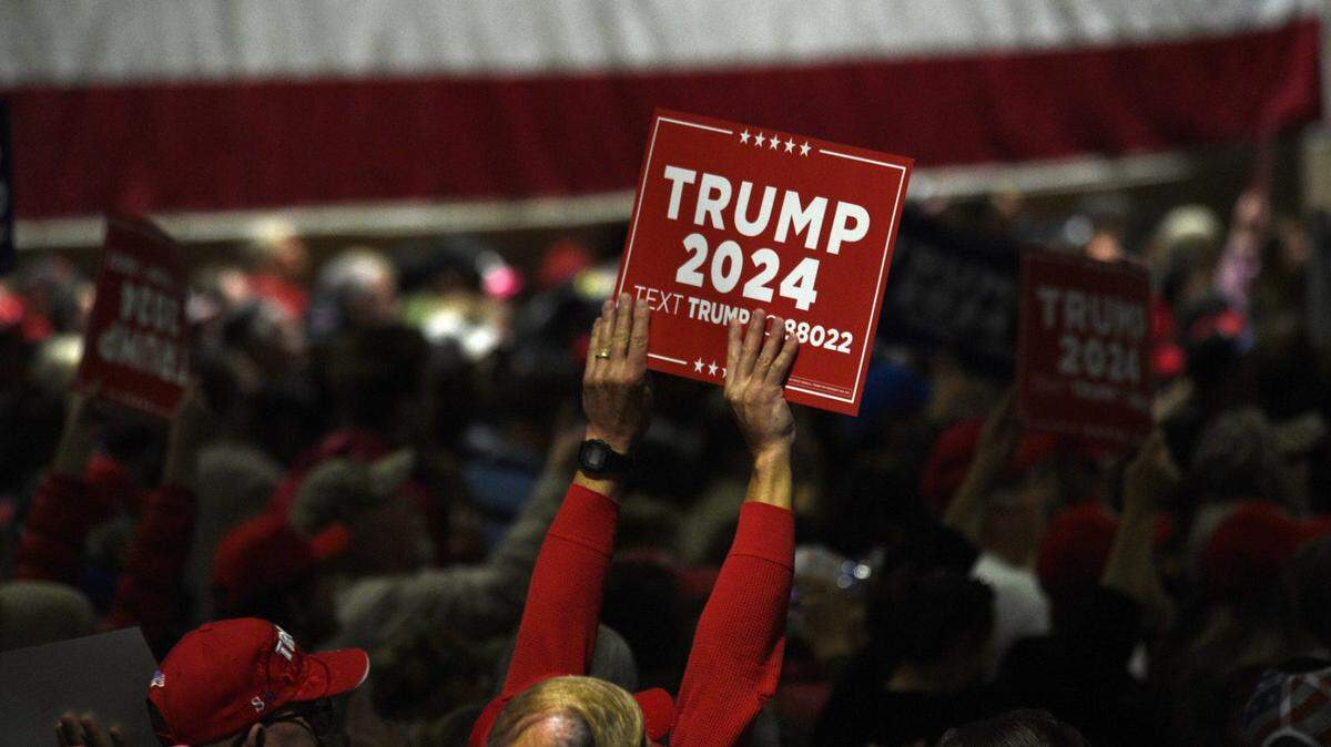 Supporters listen to Donald Trump during the Commit to Caucus Rally on Dec. 17 in Reno, Nevada.