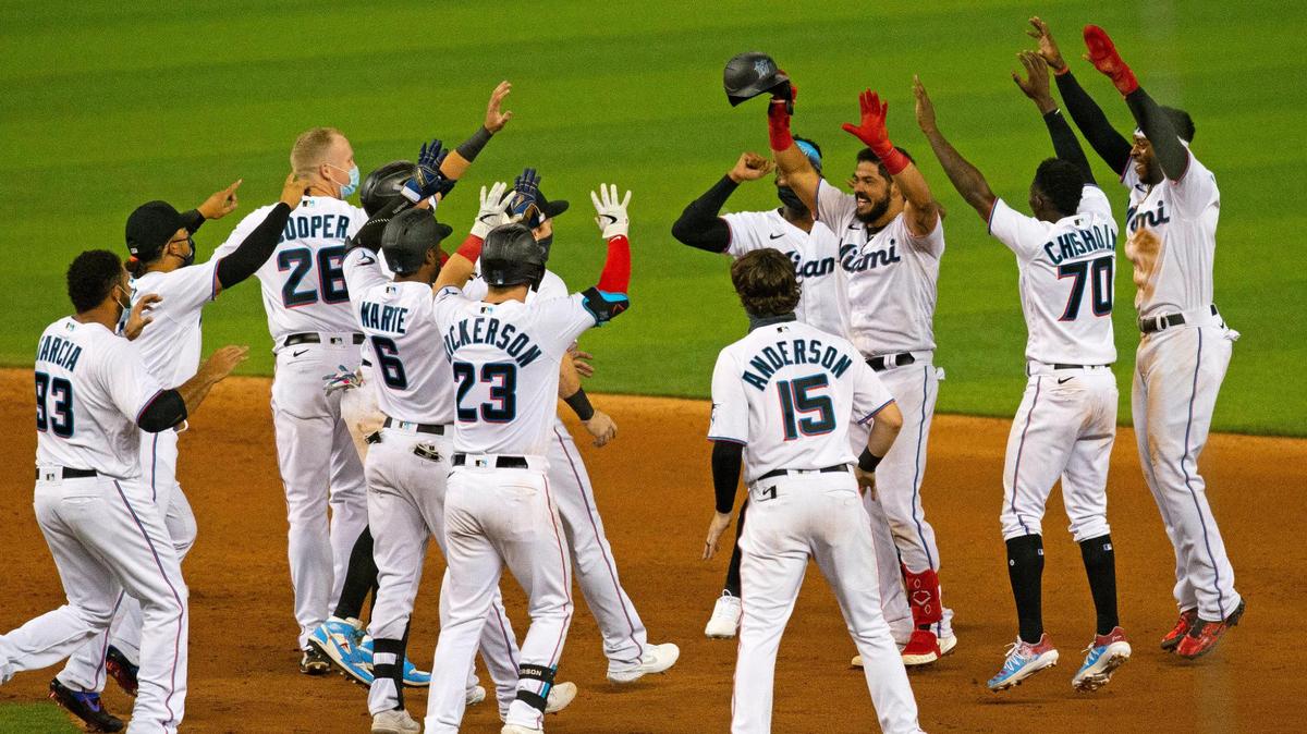 Miami Marlins catcher Jorge Alfaro (38) celebrate with teammates after hitting a walk-off RBI single in the ninth inning of a baseball game against the Philadelphia Phillies at at Marlins Park in Miami on Thursday, September 10, 2020. Marlins won 7-6.