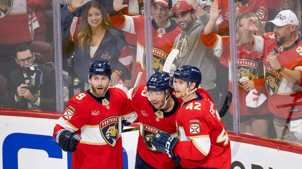 Florida Panthers center Carter Verhaeghe (23) celebrates with center Sam Bennett (9) and defenseman Gustav Forsling (42) after scoring against the Toronto Maple Leafs in the second period of Game 3 of a second-round Stanley Cup playoffs series at the Amerant Bank Arena on Friday, May 9, 2025, in Sunrise, Fla.