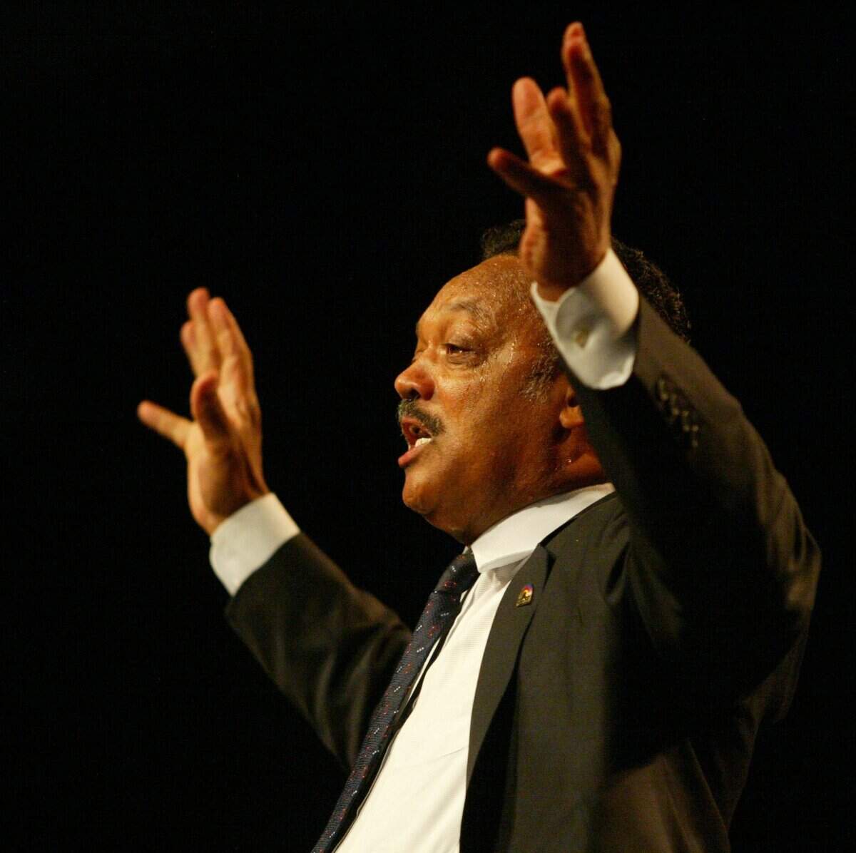 At the NAACP Convention at the Miami Beach Convention Center in 2003, the Rev. Jesse Jackson addresses the delegates.