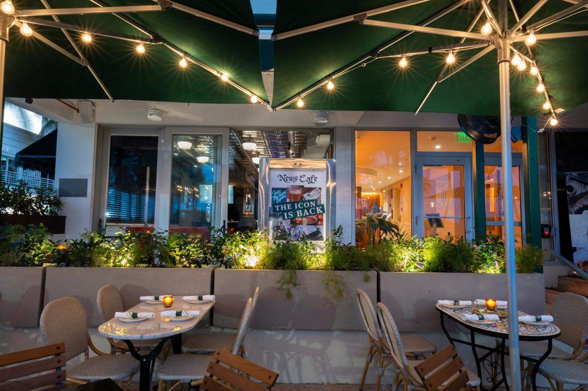 The outdoor beachfront patio of the News Café on Ocean Drive.
