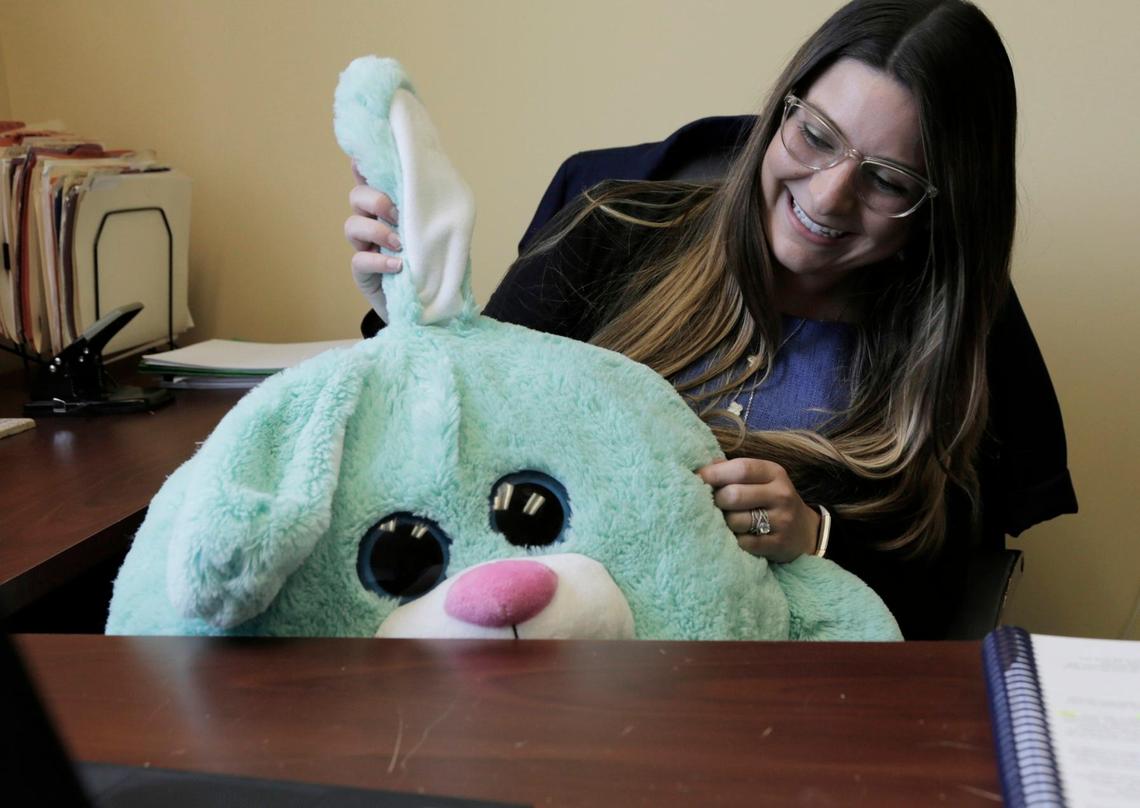 Angeliki Bouliakis Andronis, an immigration attorney working with the Children’s Legal Program at Americans for Immigrant Justice,  with a stuffed toy she often uses with her young clients.