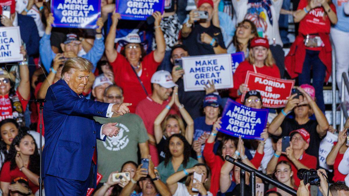 Former President Donald Trump reacts after speaking to a full house rally at the Ted Hendricks Stadium at Henry Milander Park in Hialeah, on Wednesday, November 08, 2023.