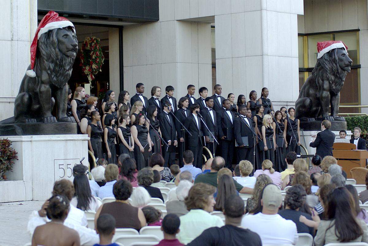 The students of Hialeah Miami Lakes Senior High sing for the crowd during the Merrick Festival Caroling Competition in Coral Gables.  