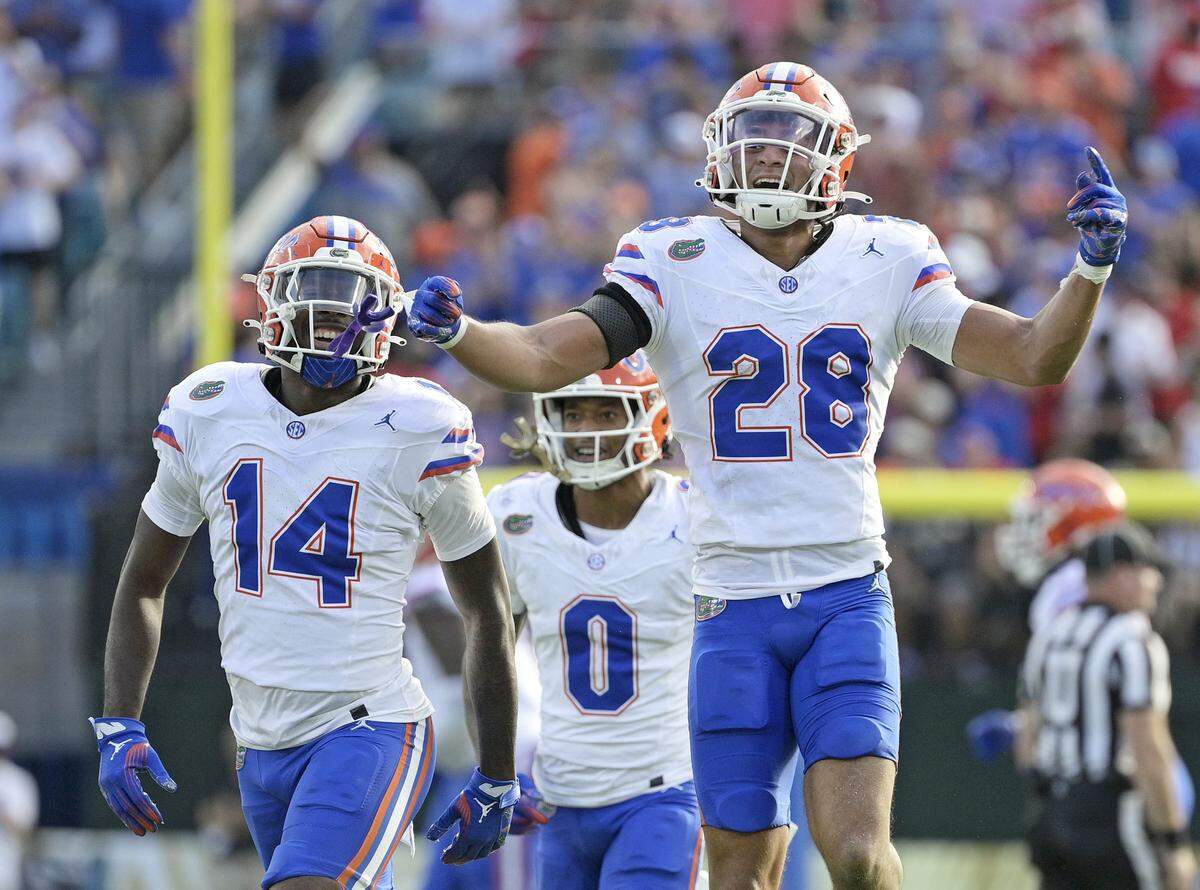 Nov 2, 2024; Jacksonville, Florida, USA; Florida Gators defensive back Devin Moore (28) celebrates after an interception against the Georgia Bulldogs during the first half at EverBank Stadium. Mandatory Credit: Melina Myers-Imagn Images