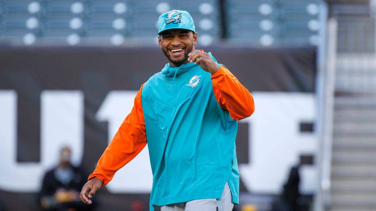 Miami Dolphins quarterback Tua Tagovailoa laughing during pregame warmups before the start of an NFL football game at Paycor Stadium on Thursday, September 29, 2022 in Cincinnati, Ohio.