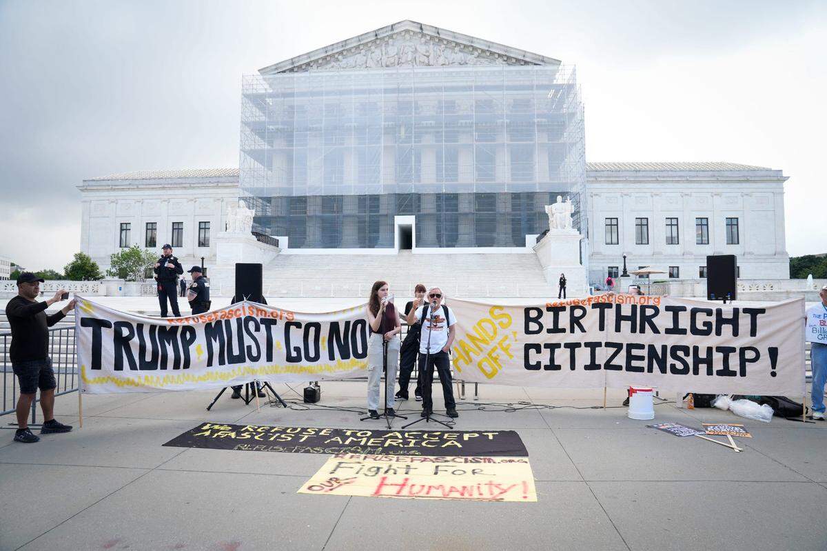 People demonstrate outside the Supreme Court before justices hears oral arguments in Trump v. CASA, Inc. At issue in the case is if the Supreme Court should stay the district courts’ nationwide preliminary injunctions on the Trump administration’s executive order ending birthright citizenship.