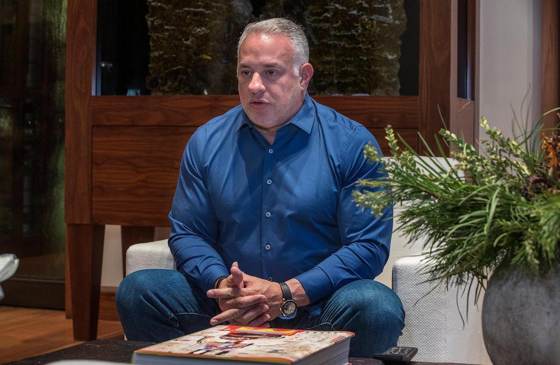 Entrepreneur, businessman and attorney, John H. Ruiz talks to Miami Herald reporter Samatha Gross at his house in Coral Gables on Dec. 8, 2021. He wants to build a stadium for the University of Miami in Coral Gables.