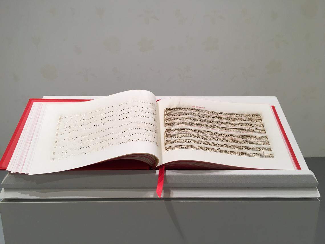 Bethany Collins. “America: A Hymnal. 2017” contains 100 versions of the lyrics to “My Country ‘Tis of Thee.”  At Locust Projects.