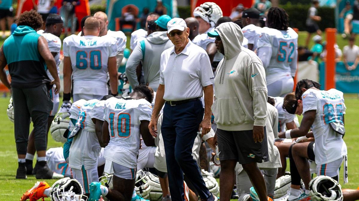 Miami Dolphins owner and chairman Stephen M. Ross, left, walks with general manager Chris Grier, right, during Day 6 of training camp at Baptist Health Training Complex on Tuesday, July 30, 2024, in Miami Gardens, Fla.