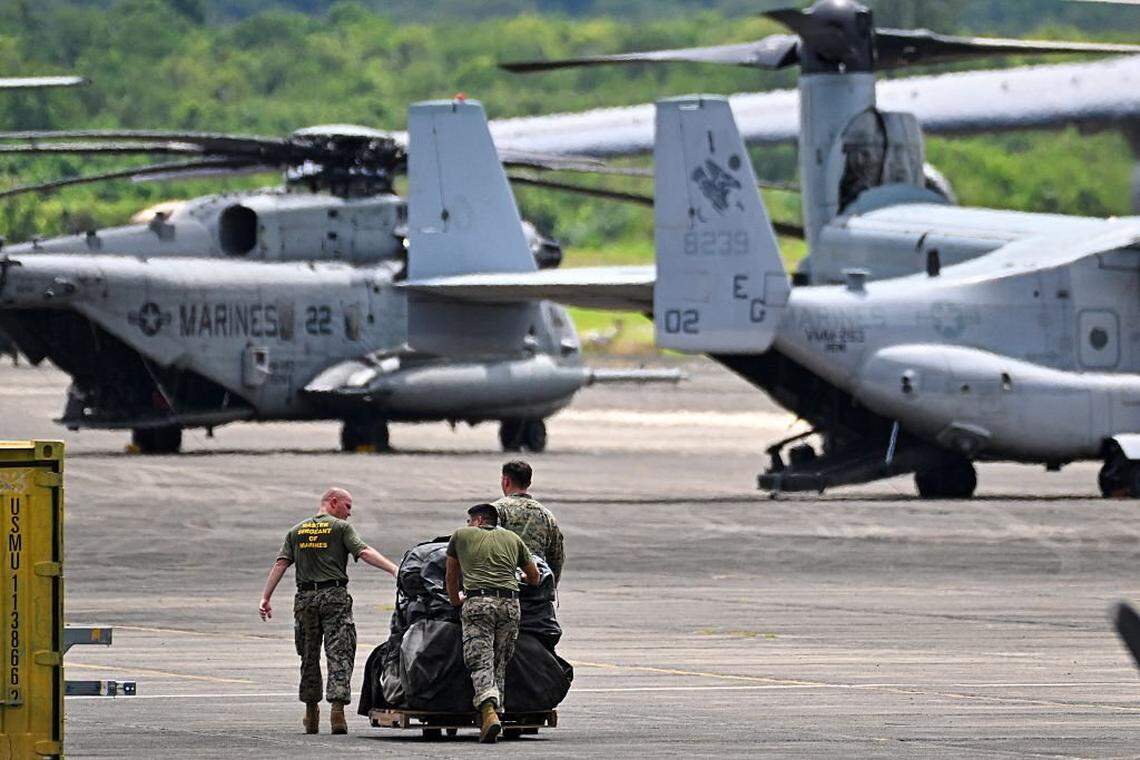 Members of the US Marine Corps, Marine Fighter Attack Squadron 225, work at JosÃ© Aponte de la Torre Airport, formerly Roosevelt Roads Naval Station, on September 13, 2025 in Ceiba, Puerto Rico. President Donald Trump is sending ten F-35 fighter jets to Puerto Rico as part of his war on drug cartels, sources familiar with the matter told AFP on September 5, as tensions mount with Venezuela over Washington's military build-up in the Caribbean. The planes will join US warships already deployed to the southern Caribbean as Trump steps up pressure on Venezuelan President Nicolas Maduro, whom the United States accuses of leading a drug cartel. The Trump administration recently carried out a drone strike in the southern Caribbean against a boat that had left Venezuela and was suspected of transporting drugs. Eleven people died in the attack. The president claimed that the vessel was operated by the Venezuelan gang Tren de Aragua. (Photo by Miguel J. Rodriguez Carrillo / AFP) (Photo by MIGUEL J. RODRIGUEZ CARRILLO/AFP via Getty Images)