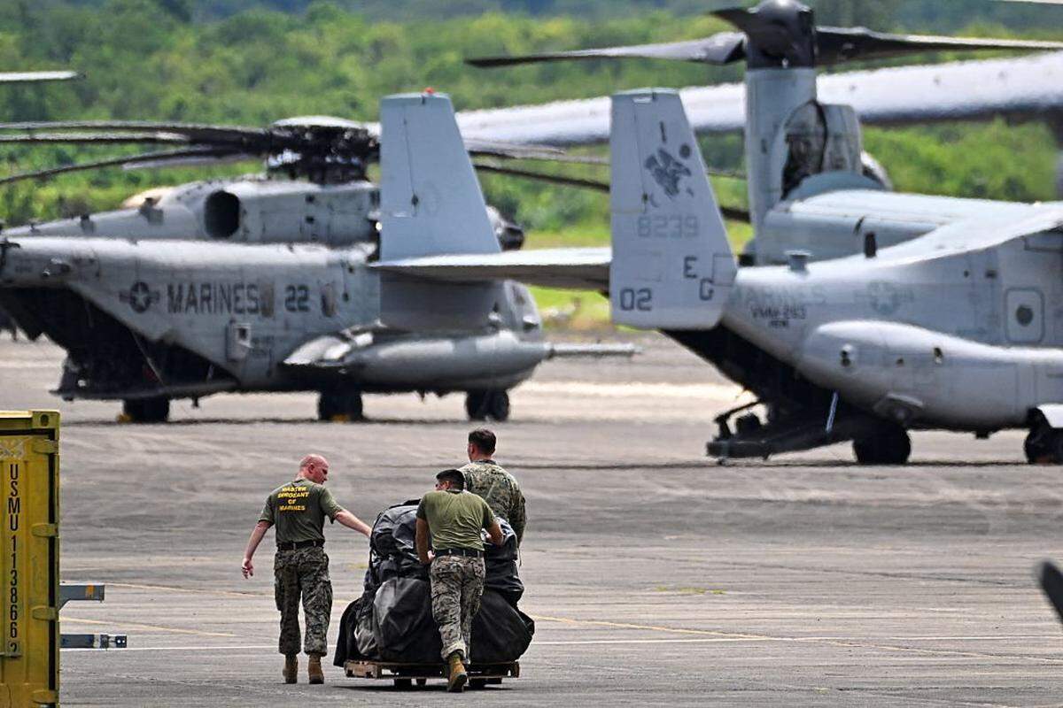 Members of the U.S. Marine Corps, Marine Fighter Attack Squadron 225, work at José Aponte de la Torre Airport, formerly Roosevelt Roads Naval Station, on September 13, 2025 in Ceiba, Puerto Rico. President Donald Trump is sending ten F-35 fighter jets to Puerto Rico as part of his war on drug cartels, sources familiar with the matter told AFP on September 5, as tensions mount with Venezuela over Washington’s military build-up in the Caribbean. (Photo by MIGUEL J. RODRIGUEZ CARRILLO/AFP via Getty Images)