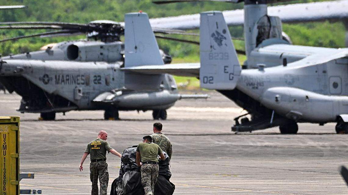 Members of the US Marine Corps, Marine Fighter Attack Squadron 225, work at JosÃ© Aponte de la Torre Airport, formerly Roosevelt Roads Naval Station, on September 13, 2025 in Ceiba, Puerto Rico. President Donald Trump is sending ten F-35 fighter jets to Puerto Rico as part of his war on drug cartels, sources familiar with the matter told AFP on September 5, as tensions mount with Venezuela over Washington's military build-up in the Caribbean. The planes will join US warships already deployed to the southern Caribbean as Trump steps up pressure on Venezuelan President Nicolas Maduro, whom the United States accuses of leading a drug cartel. The Trump administration recently carried out a drone strike in the southern Caribbean against a boat that had left Venezuela and was suspected of transporting drugs. Eleven people died in the attack. The president claimed that the vessel was operated by the Venezuelan gang Tren de Aragua. (Photo by Miguel J. Rodriguez Carrillo / AFP) (Photo by MIGUEL J. RODRIGUEZ CARRILLO/AFP via Getty Images)