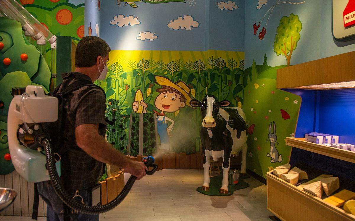 Staff member John Laurence uses a fogger disinfecting machine to sanitize different areas at the Miami Children’s Museum on Tuesday, April 27, 2021.
