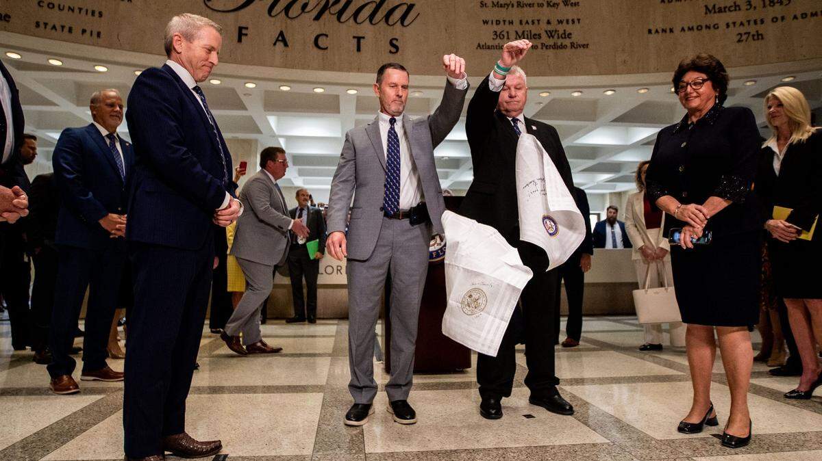 The sergeants-at-arms complete the traditional hanky drop that signifies the end of the legislative session in the rotunda of the Florida Capitol in Tallahassee on Friday, May 5, 2023. At left is House Speaker Paul Renner, and at right is Senate President Kathleen Passidomo.