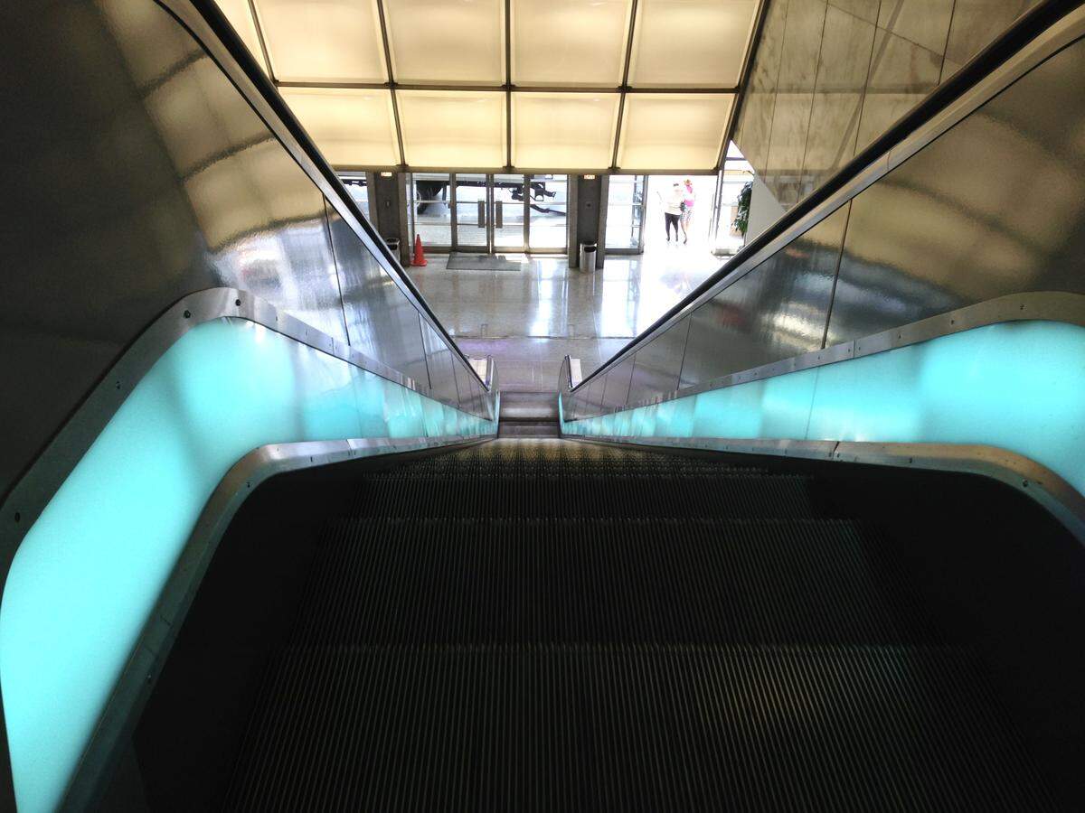 The Miami Herald escalator leading down toward the lobby inside the former headquarters at One Herald Plaza on May 10, 2013, shortly before the company departed its building that had been sold.