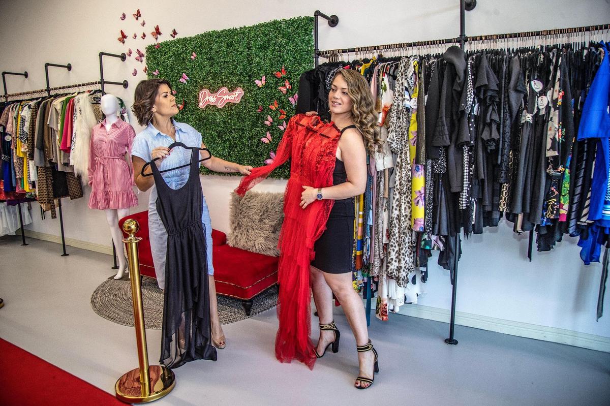Redress operator Rossanna Ceccato plans to open another brick-and-mortar location in New York City later this year. After Miami, Ceccato found most Redress users come from the Big Apple. Above: Ceccato, left, helps real estate agent Grecia Colmenares try on a dress.