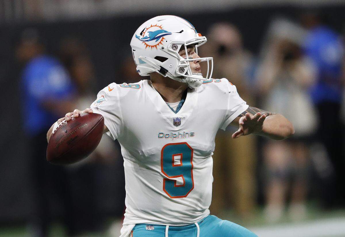 Miami Dolphins quarterback David Fales (9) works against the Atlanta Falcons during the first half of an NFL preseason football game, Thursday, Aug. 30, 2018, in Atlanta.