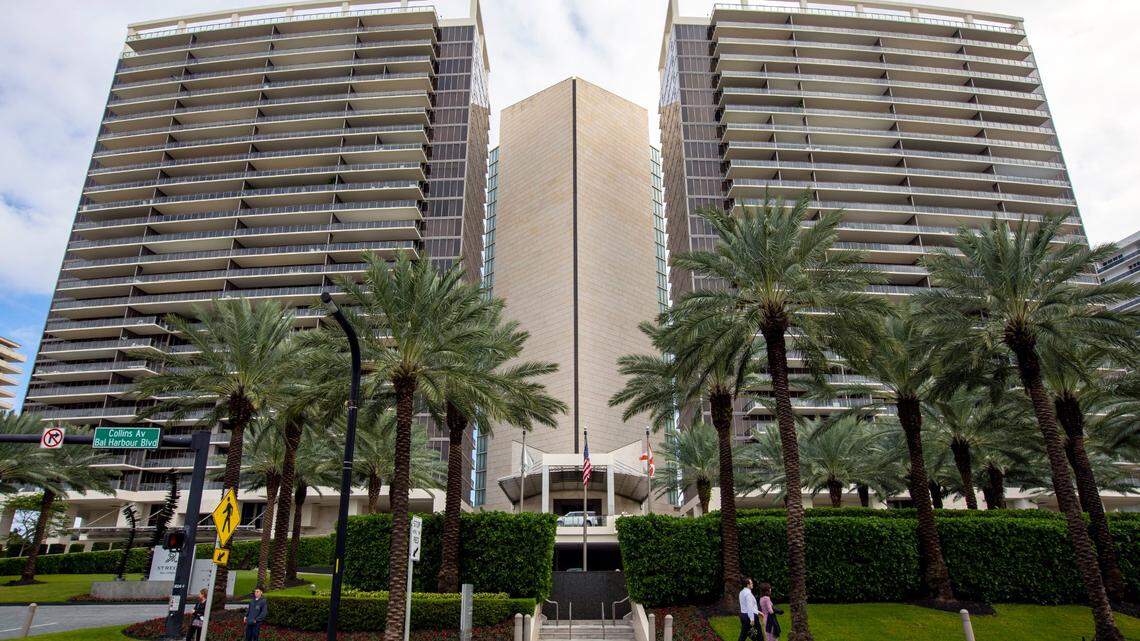 An exterior shot from Collins Avenue of people walking past the St. Regis Bal Harbour Resort, in Bal Harbour, Florida, Tuesday, November 21, 2020.