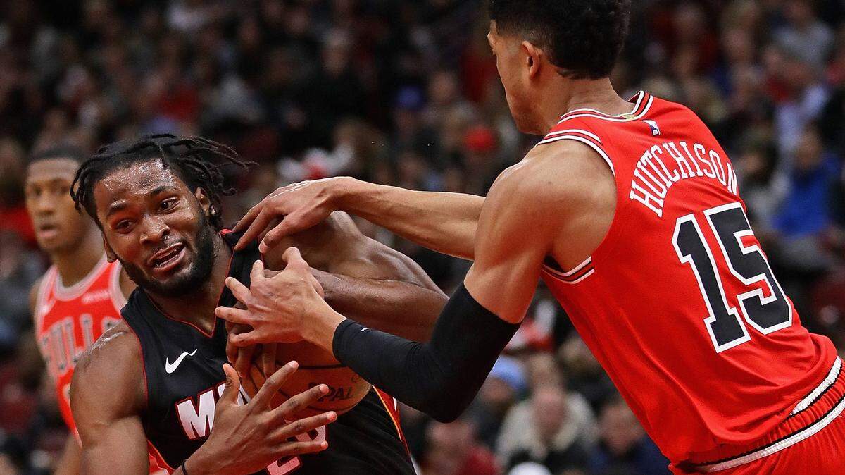 Chicago Bulls’ Chandler Hutchison (15) ties up Miami Heat’s Justise Winslow (20) at United Center on January 19, 2019 in Chicago.