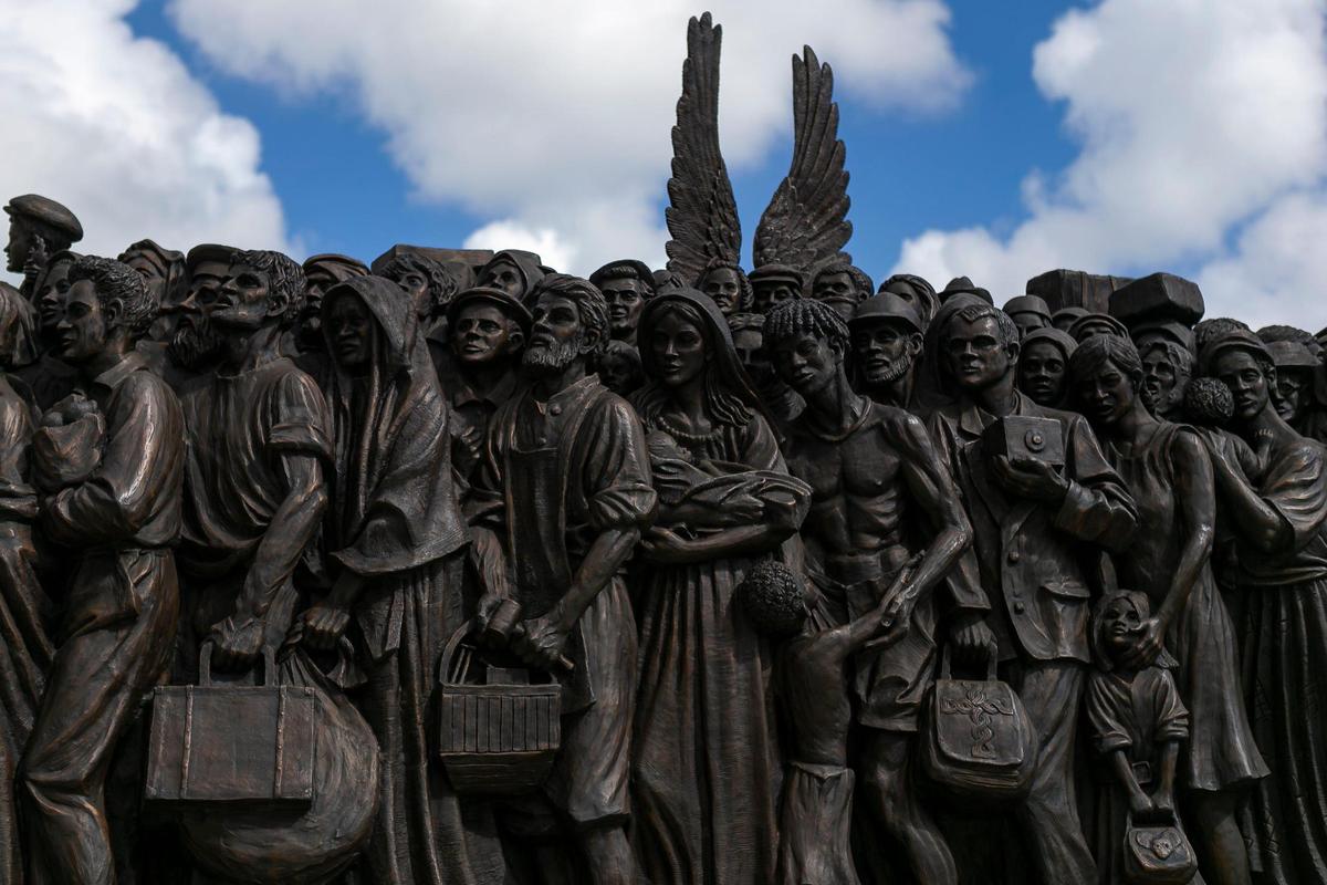 The traveling bronze sculpture titled “Angels Unawares,” is on display at Bayfront Park in downtown Miami on Wednesday, February 10, 2021. The life-sized sculpture will be open to the public daily for viewing until April 8. The sculpture weighs four tons and is 20-feet long. It features indigenous people, Jews fleeing Nazi Germany, Joseph, Mary, Jesus, and much more.