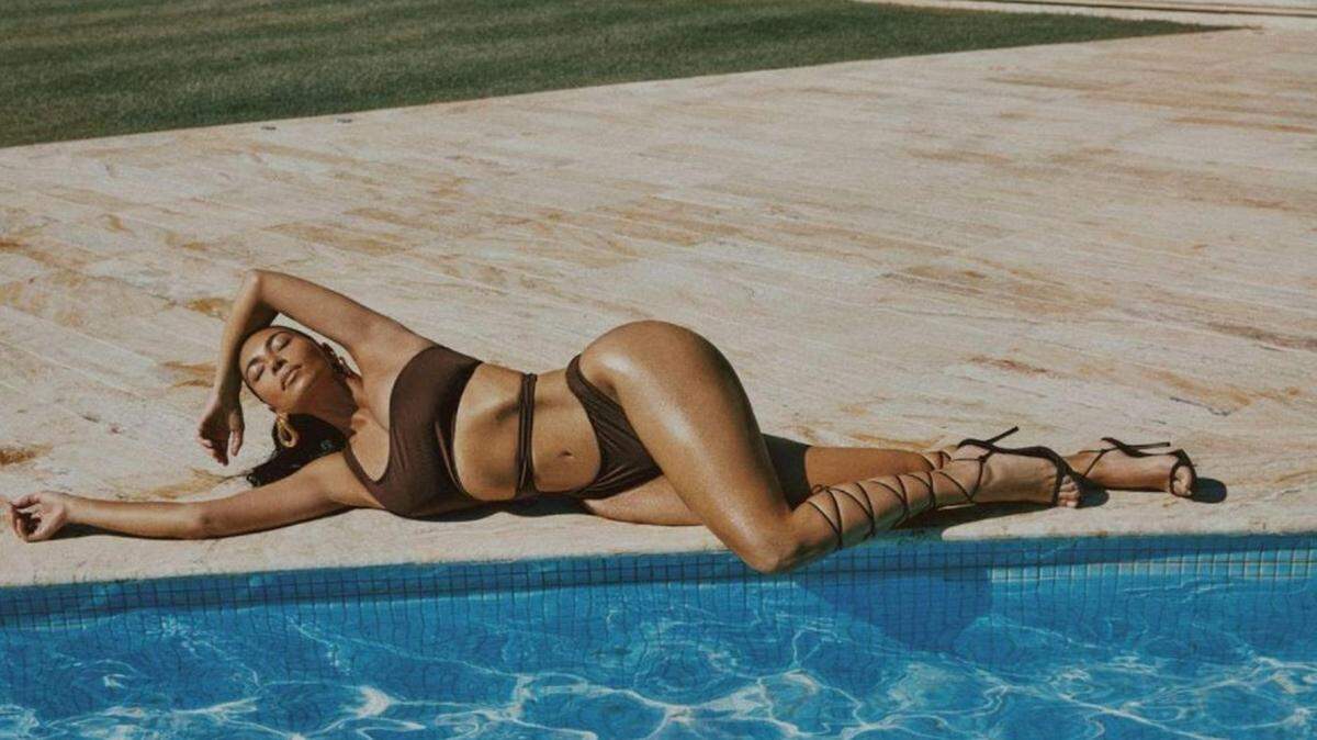 KIm Kardashian models SKIMS SWIM