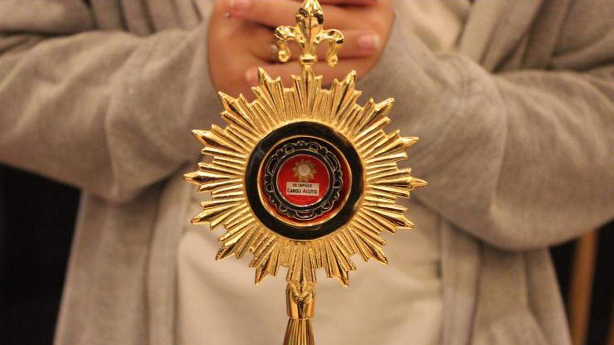 A relic of Carlo Acutis, known as Blessed Carlo Acutis in the Catholic Church, is displayed at the IV International Eucharistic-Marian Congress organized by the Servants of the Pierced Hearts of Jesus and Mary in 2022. Acutis is to become the church’s first millennial saint in 2025.