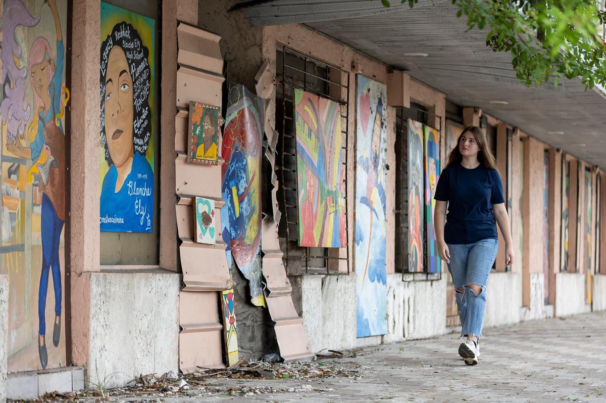 Yana Danzig visits Cone Plaza in the Sistrunk neighborhood on Tuesday, July 2, 2024, in Fort Lauderdale, Florida. Danzig, a Silver Knight winner in art, started “Brushstrokes for History,” bringing together local artists to create art on plywood panels that were then used to board up vacant buildings like Cone Plaza.