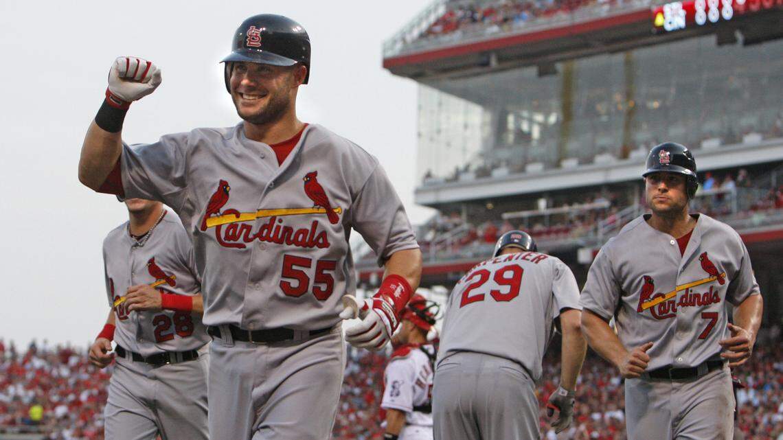 St. Louis Cardinals’ Skip Schumaker (55) celebrates after hitting a grand slam home run off Cincinnati Reds pitcher Mike Leake in the fourth inning of a baseball game Monday, August 9, 2010 in Cincinnati. Cardinals players Colby Rasmus (28), Chris Carpenter (29), and Matt Holliday (7) are seen in background. The Cardinals won 7-3.