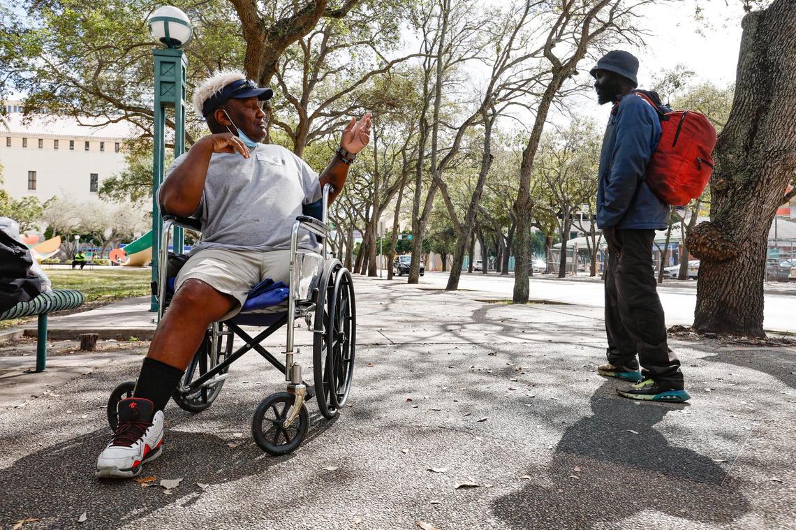 Armando Rivero, 64, waves at a passerby after the announcement of financial assistance being provided by the U.S. Department of Housing and Urban Development to help people experiencing homelessness. The press conference was held at the Stephen Clark Center, where many of Miami’s homeless population live, on Thursday, Feb. 2, 2023.