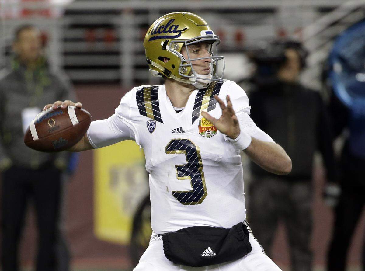 FILE- In this Dec. 26, 2015 file photo, UCLA quarterback Josh Rosen throws against Nebraska during the first half of the Foster Farms Bowl NCAA college football game, in Santa Clara, Calif.