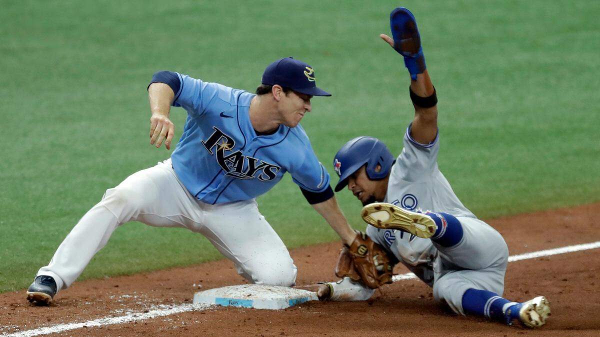 The Toronto Blue Jays’ Santiago Espinal, a former Miami Dade College standout, steals third base during the 10th inning of their victory against the Tampa Rays Sunday, July 26, 2020, in St. Petersburg.