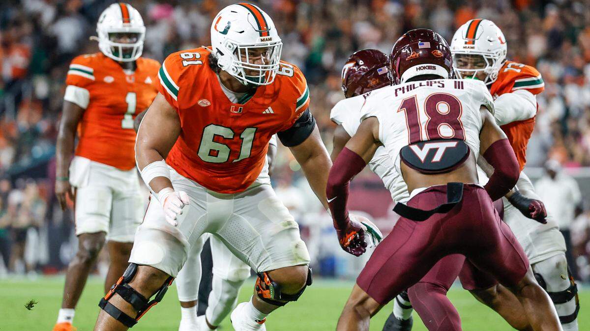 Miami Hurricanes offensive lineman Francis Mauigoa (61) sets up to block during the first half of an ACC conference football game against the Virginia Tech Hokies at Hard Rock Stadium on Friday, September 27, 2024, in Miami Gardens, Fla.

