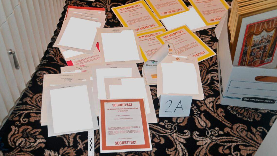 FILE - This image contained in a court filing by the Department of Justice on Aug. 30, 2022, and partially redacted by the source, shows a photo of documents seized during the Aug. 8 FBI search of former President Donald Trump’s Mar-a-Lago estate.(Department of Justice via AP, File)