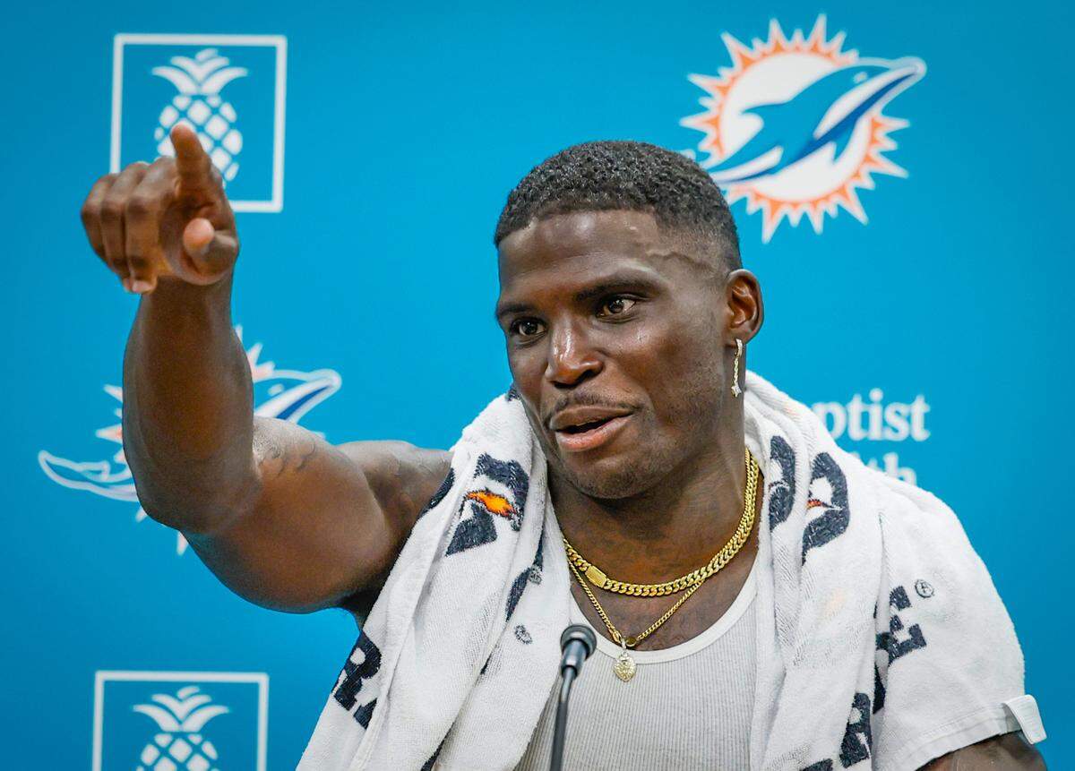 Miami Dolphins wide receiver Tyreek Hill (10) speaks to reporters during a press conference at the Miami Dolphins Training Camp in Miami Gardens, Florida, on Tuesday, July 22, 2025.