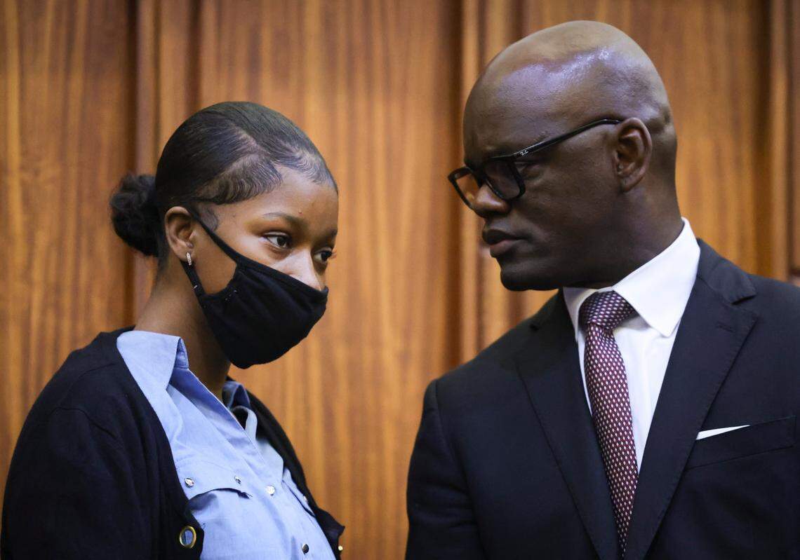 Jahara Malik, charged with manslaughter in the fatal stabbing of Yahkeim “Keimo” Lollar, a student-athlete from Northwestern High School, left, talks with one of her defense attorneys, Kionne McGhee, a Miami-Dade commissioner, during a pre-trial hearing on Thursday, Feb. 6, 2025, at the Richard E. Gerstein Justice Building in downtown Miami. 