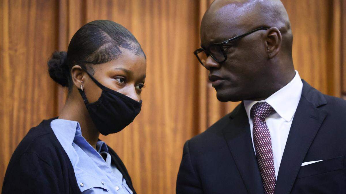 Jahara Malik, charged with manslaughter in the fatal stabbing of Yahkeim Lollar, a student athlete from Miami Northwestern High School, left, talks with one of her attorneys, Miami-Dade Commissioner Kionne McGhee, during a hearing on Thursday, Feb. 6, 2025, at the Richard E. Gerstein Justice Building in downtown Miami. A judge ordered her under house arrest until trial.