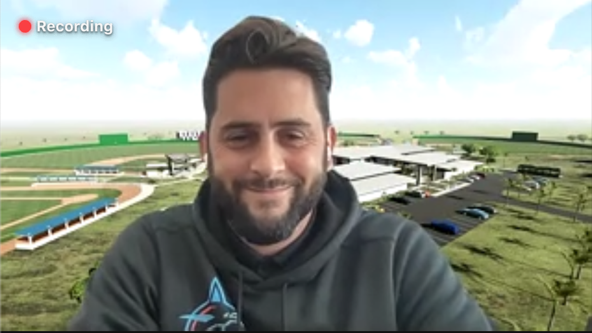 Miami Marlins senior director of international operations Adrian Lorenzo speaks on Zoom on Tuesday, Jan. 18, 2022. His video background is a rendering of the Marlins’ new player development complex in the Dominican Republic.