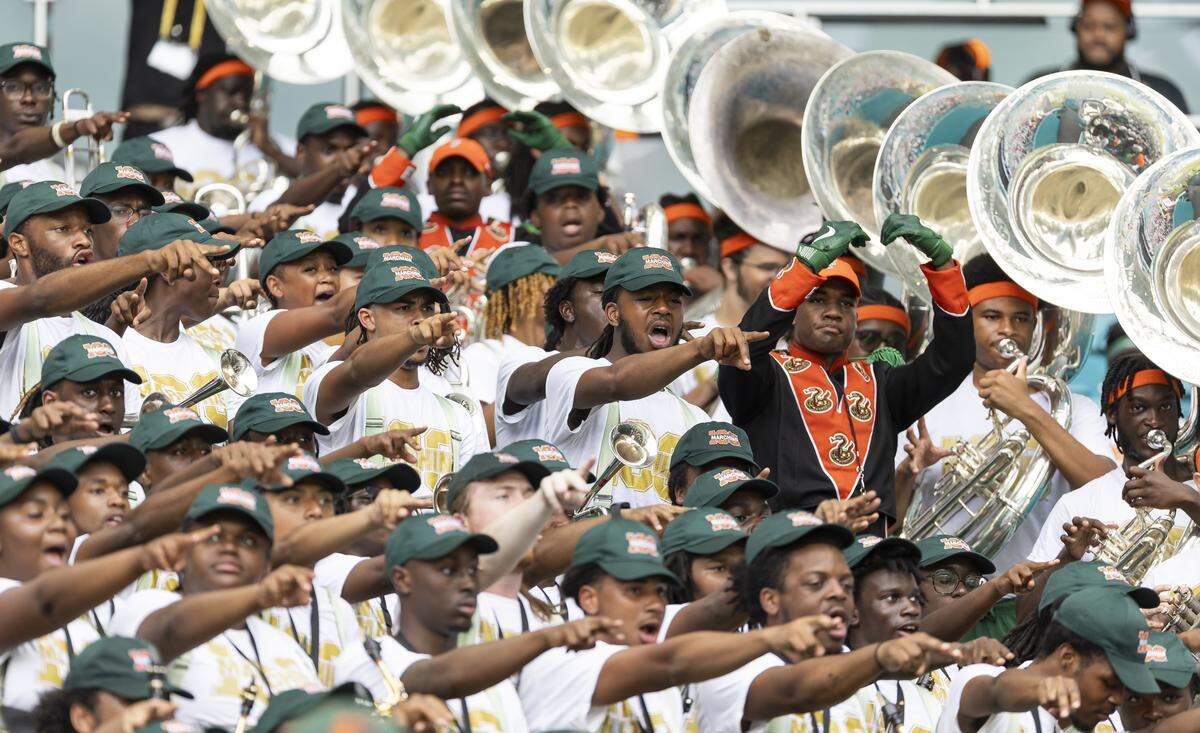 The Marching 100 perform as their team Florida A&M Rattlers plays against Howard Bison in the first half of their Orange Blossom Classic football game at Hard Rock Stadium on Saturday, Aug. 30, 2025, in Miami Gardens, Fla.