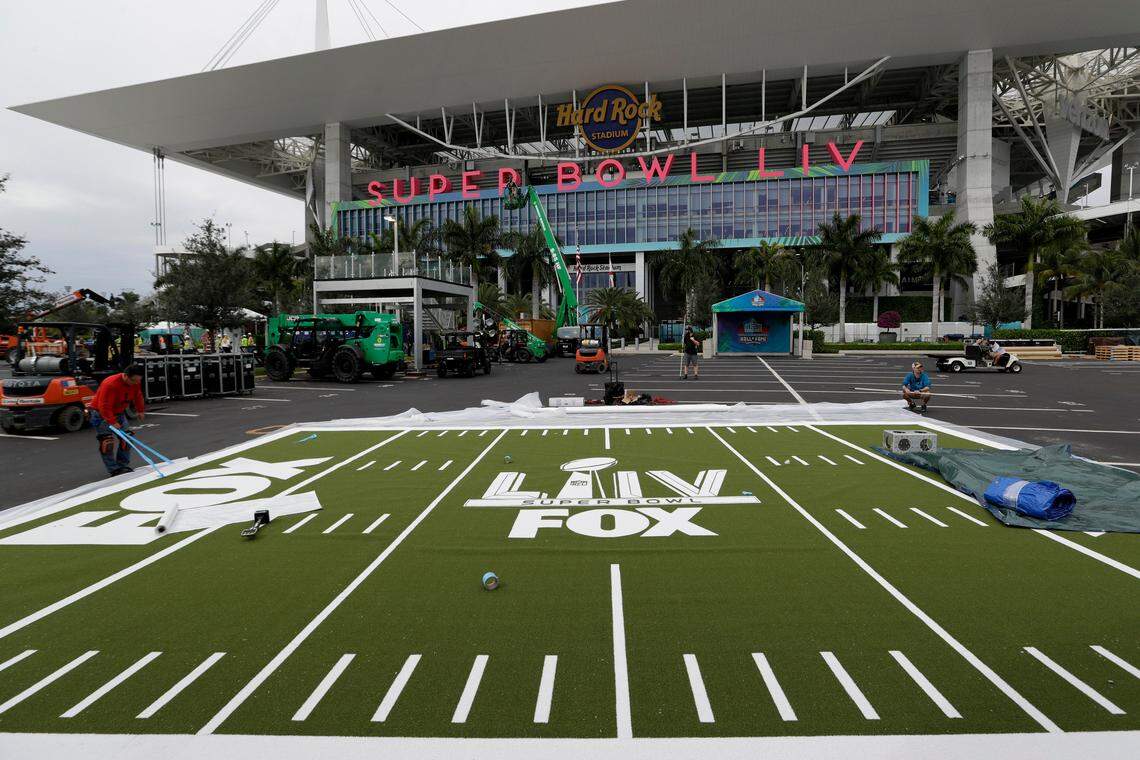 Rudy Morales works on the setup outside of the Hard Rock Stadium Monday, Jan. 27, 2020, in Miami Gardens, Florida., in preparation for the NFL Super Bowl 54 football game.