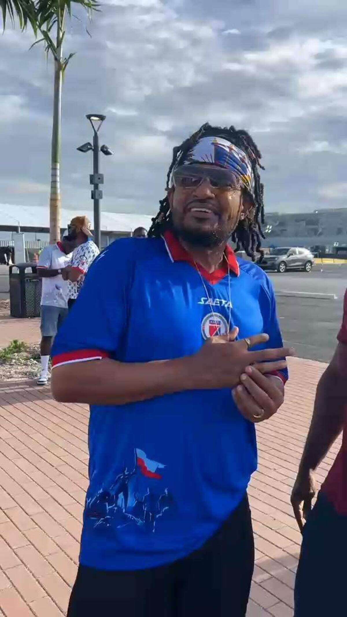 Haitian singer Alan Cavé outside of Nu Stadium in Miami on Friday, June 5, 2026, ahead of Haiti’s match against Peru, wearing an authentic Haiti men’s national soccer team jersey that FIFA said could not be worn during World Cup matches. The right side of the jersey features an illustration of the of Nov. 18, 1803 Bataille de Vertières with the Haitian flag. The team qualified for its first World Cup in 52 years on the battle’s 222nd anniversary. .