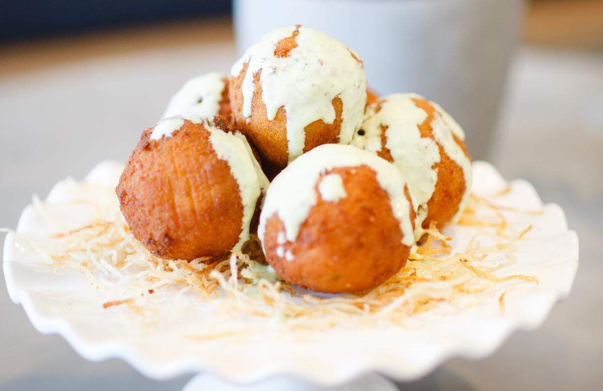 The bolitas de rabo encendido are made from long-braised ox tail at Cao Bakery & Cafe.