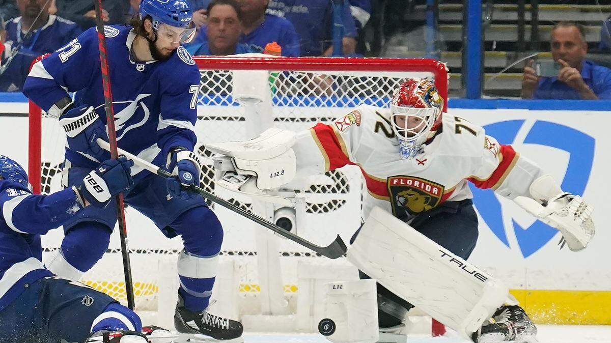Tampa Bay Lightning center Anthony Cirelli (71) tries to get off a shot on Florida Panthers goaltender Sergei Bobrovsky (72) during the first period in Game 3 of an NHL hockey second-round playoff series Sunday, May 22, 2022, in Tampa, Fla. (AP Photo/Chris O’Meara)