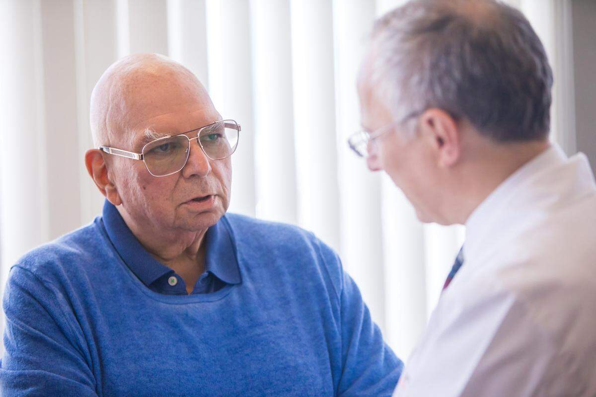 Marvin Pickholz, 76, of Fort Lauderdale, talks to Dr. Jeffrey Goldberger, chief of the cardiovascular division at UHealth. Pickholz has AFib and is participating in a study of Goldberger’s.