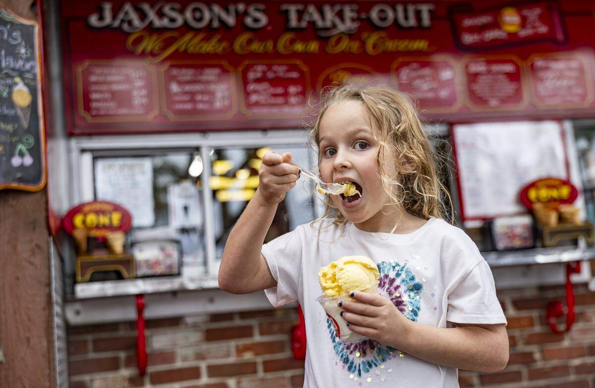 Charlee MacMullen, 6, enjoys a piña colada and tropical coconut ice cream from Jaxson's Ice Cream Parlor & Restaurant on Thursday, Feb. 5, 2026, in Dania Beach, Fla. Jaxson's is celebrating its 70th anniversary this month.
