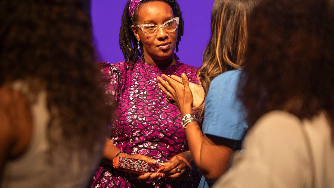 Jamarah Amani talks to women before a Birth Justice Film Screening and a panel discussion about the closure of the maternity ward at North Shore Hospital in Little Haiti Cultural Center on Saturday, April 13, 2024. Amani is a licensed midwife and executive director of Southern Birth Justice Network.