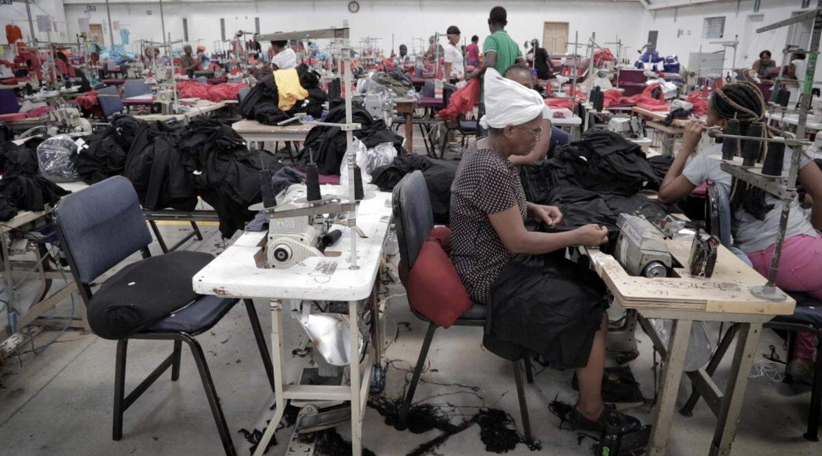 In this file photo, a female Haitian factory worker sews at Cleveland Manufacturing in Port-au-Prince, Haiti. 