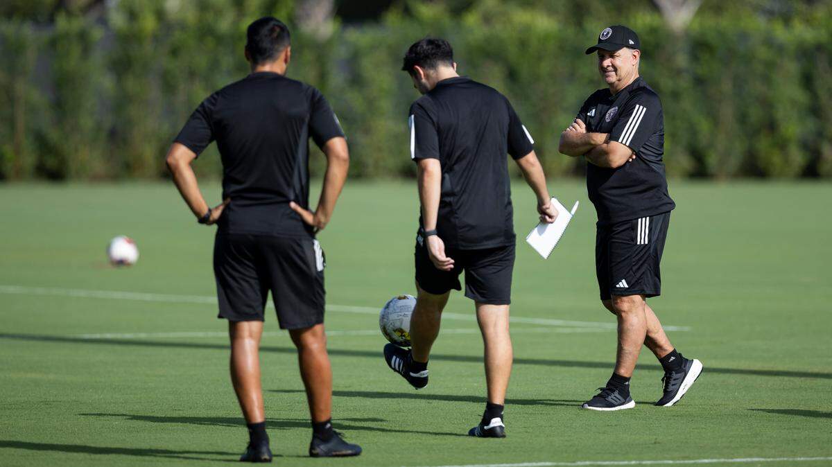 Inter Miami head coach Tata Martino, far right, is seen on the field before the start of a team practice session at the Florida Blue Training Center on Monday, July 10, 2023, in Fort Lauderdale, Fla.