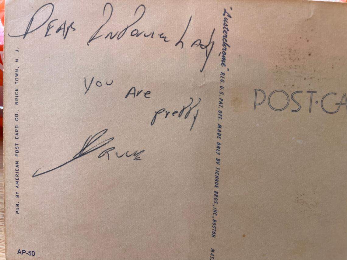 Bruce Springsteen’s inscription on the back of a postcard her sent to Christine Dolen when she was a rock music critic for The Detroit Free Press in the early-1970s. She was sent to interview him and his manager asked her to show him around town. She took Springsteen and his E Street Band to the circus. “Dear Interview Lady. You are pretty,” Springsteen wrote.