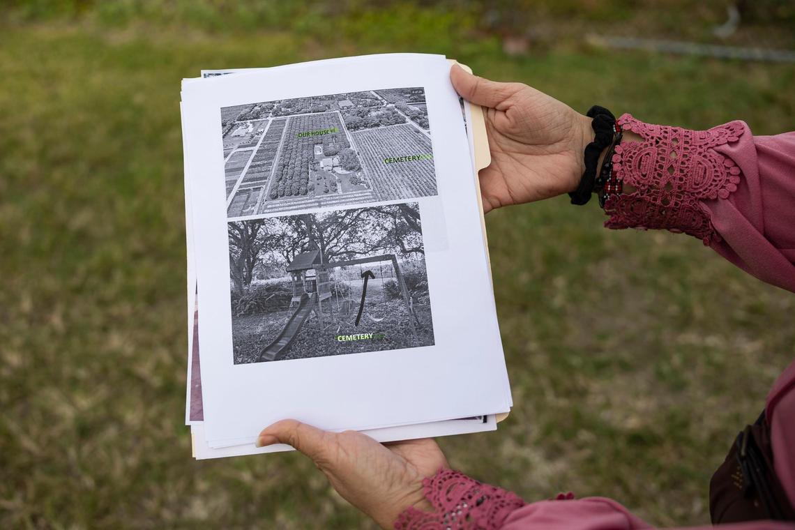 Margarita Valencia holds a photo showing the proximity of a proposed Muslim cemetery site to her home in the Redlands.
